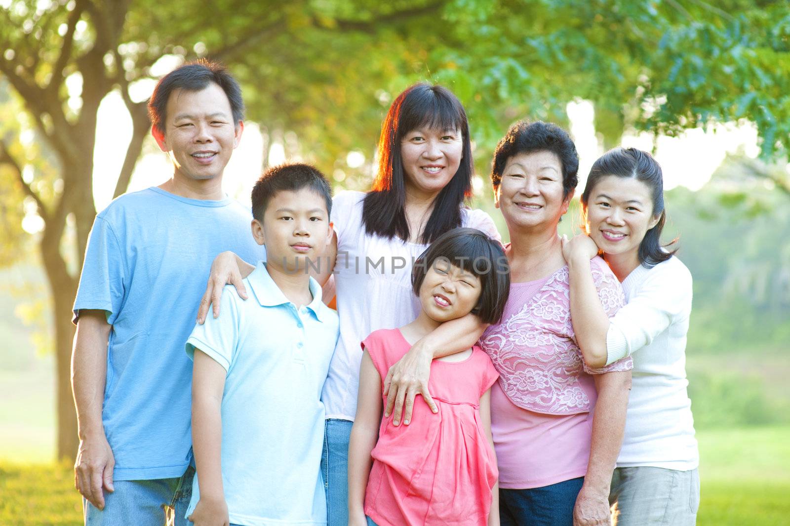 Asian family having a great time at outdoor park
