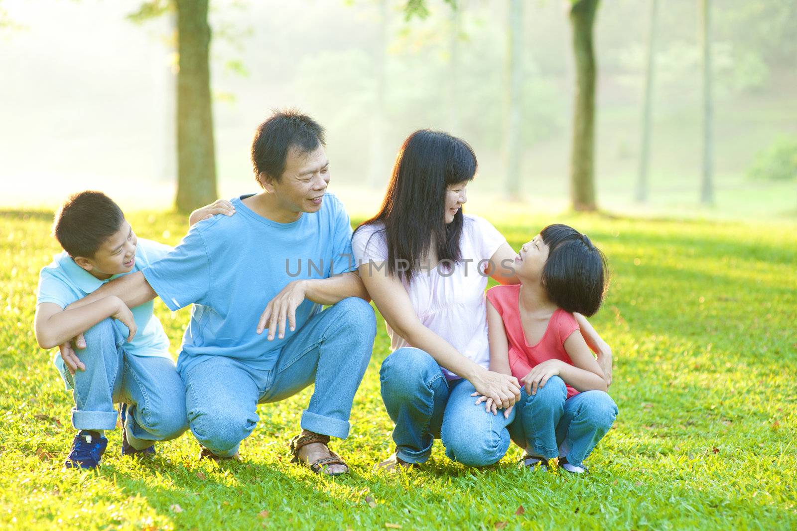 Outdoor park happy Asian family