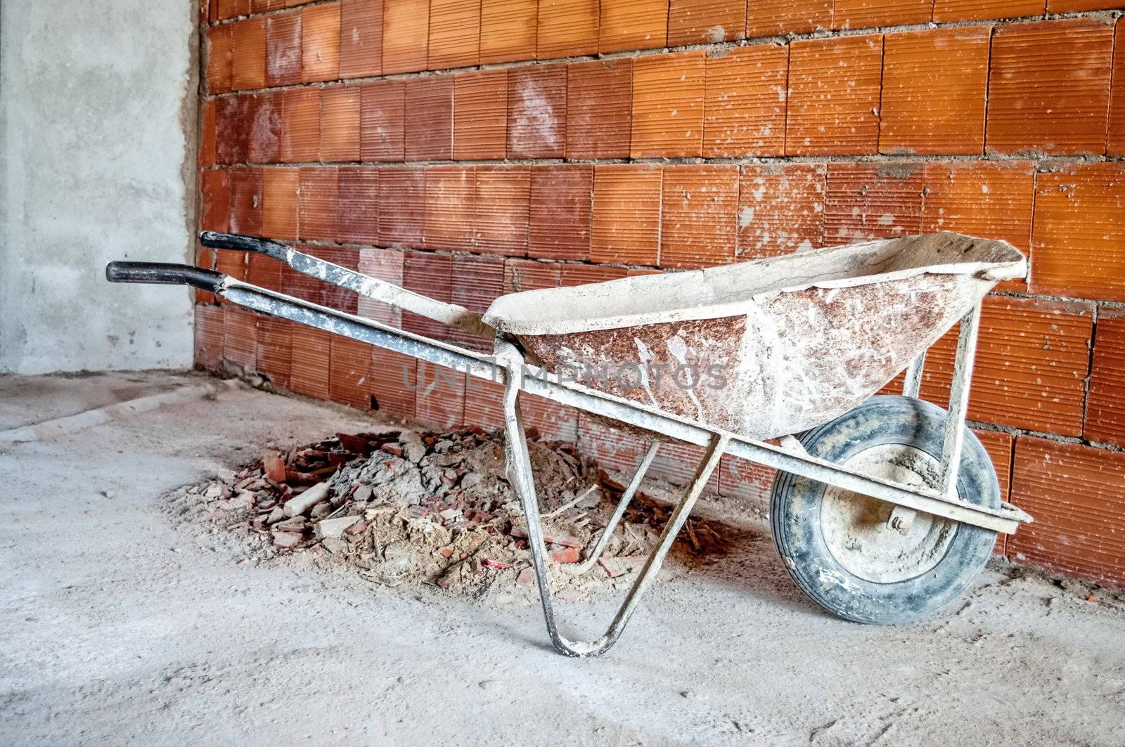 wheelbarrow in workplace by rigamondis