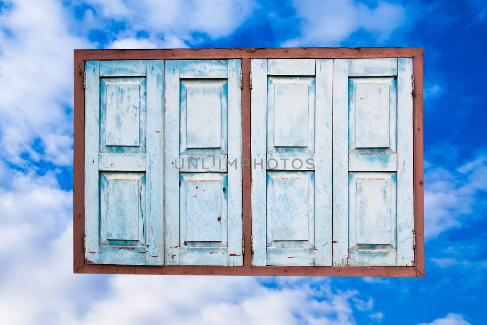 The Old window on the sky background