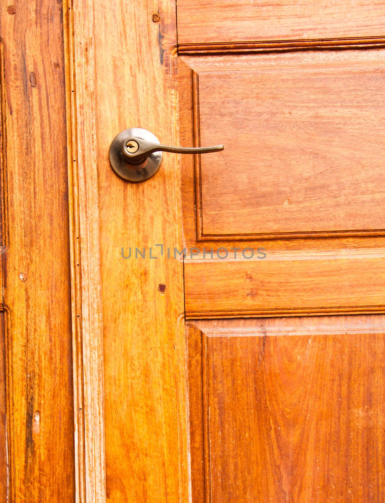 Wooden door with a knob.