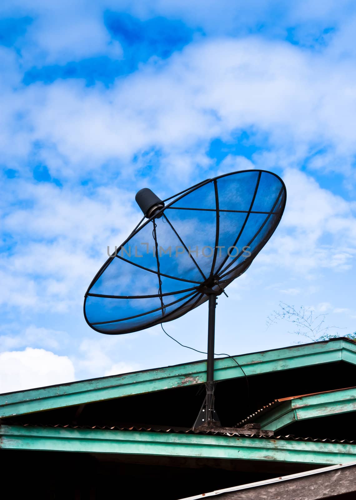 Satellite dish on the roof by Theeraphon