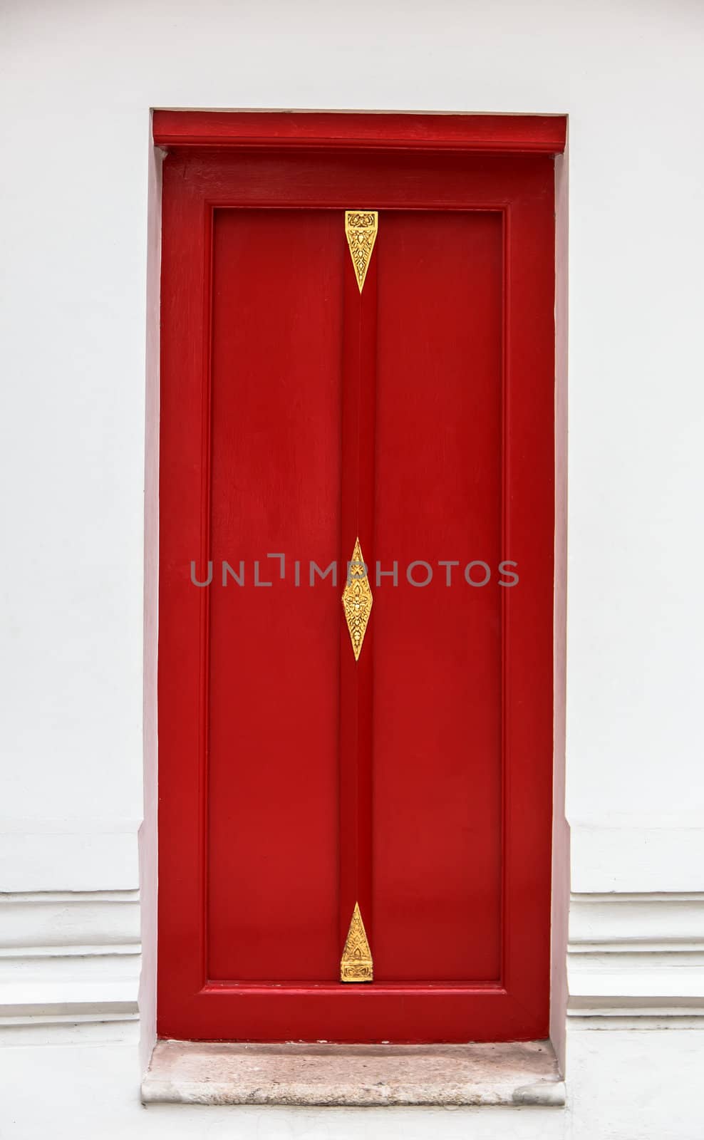 Thai style red door with traditional carving patterns by punpleng