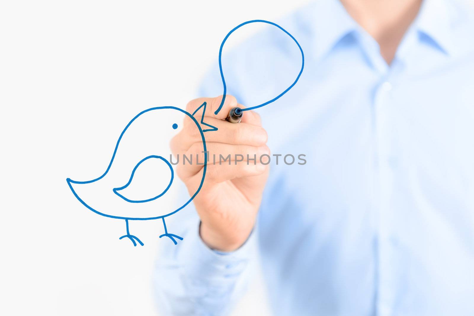 Young businessman drawing social media communication concept. Isolated on white.