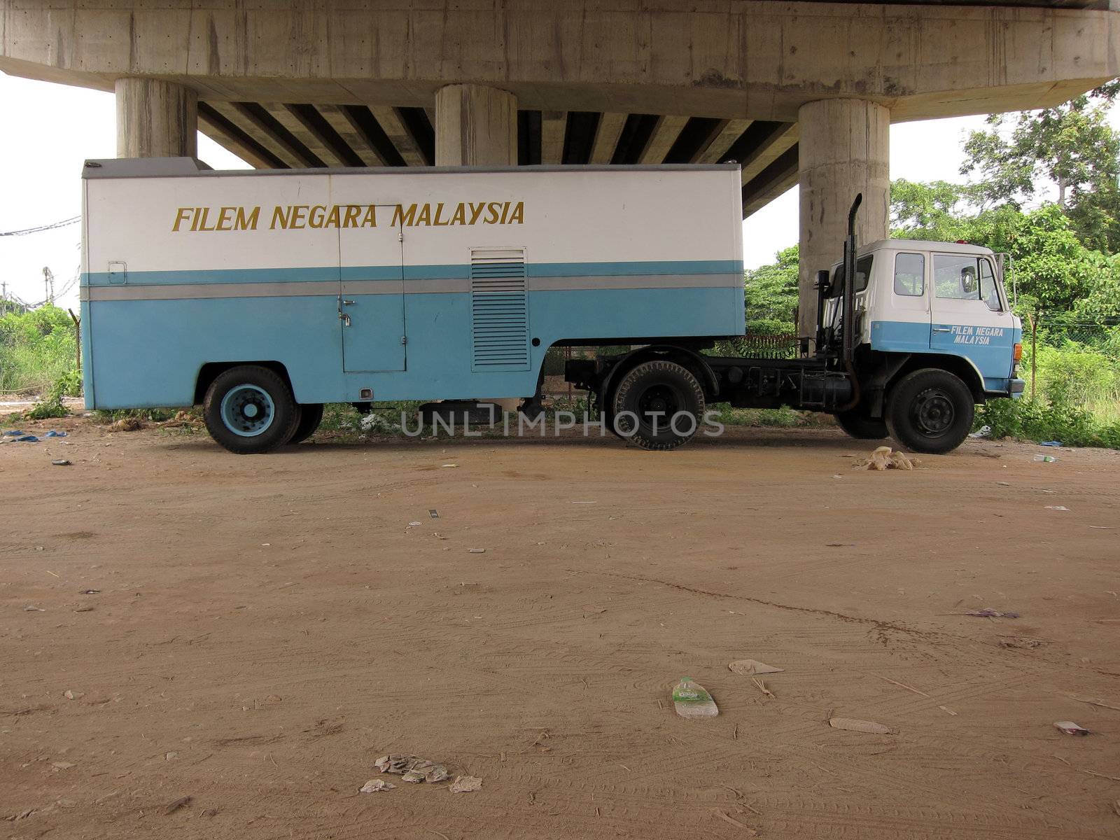 Blue movie truck under the bridge, Hanyut the movie, Malaysia