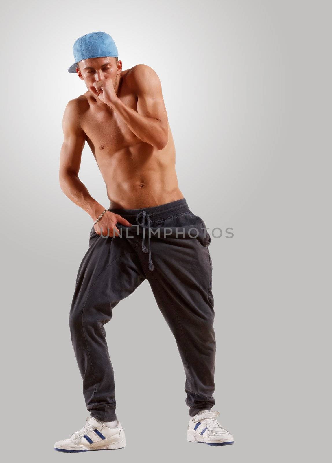 young man dancing hip hop by sergey_nivens