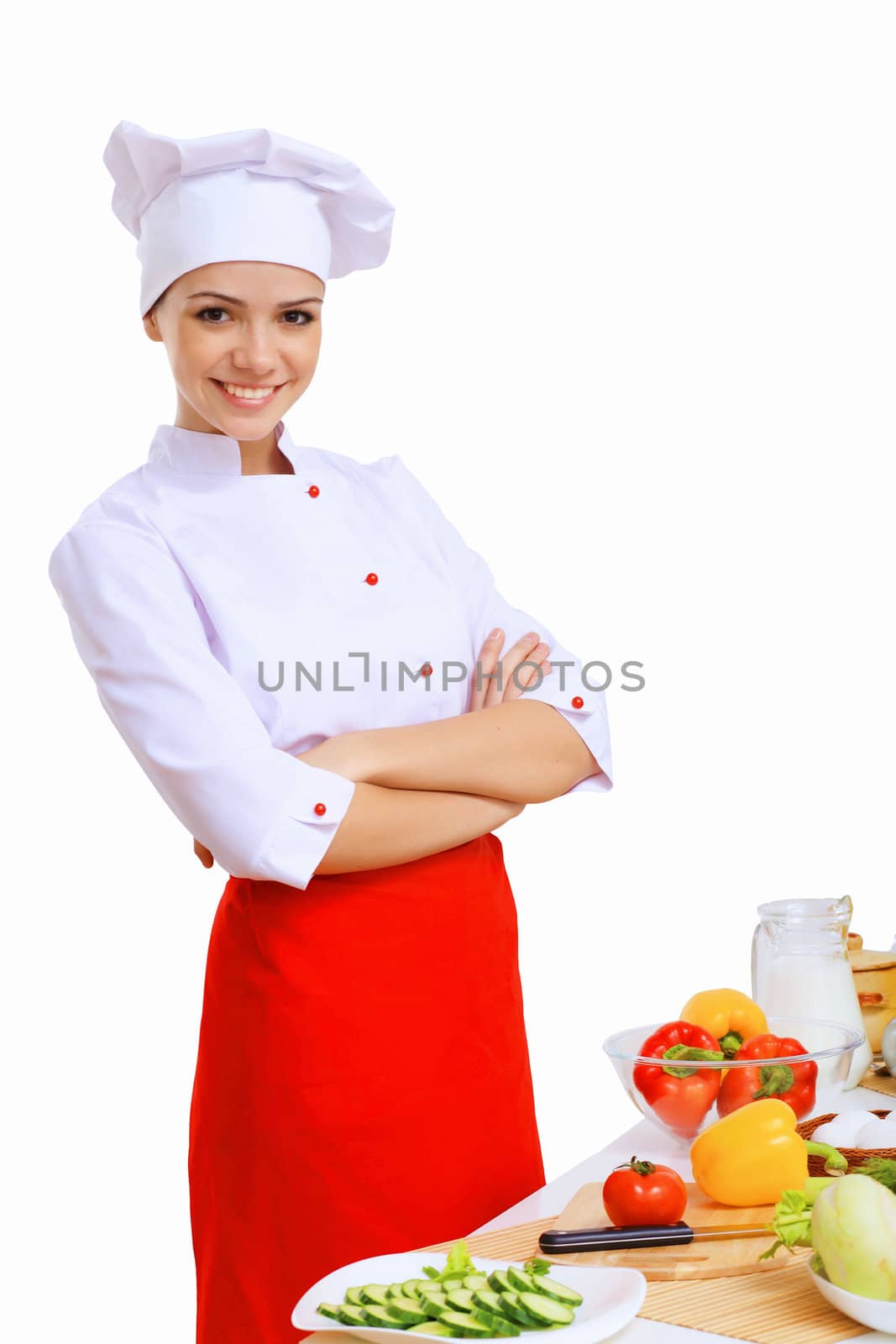 Young cook preparing food with red apron