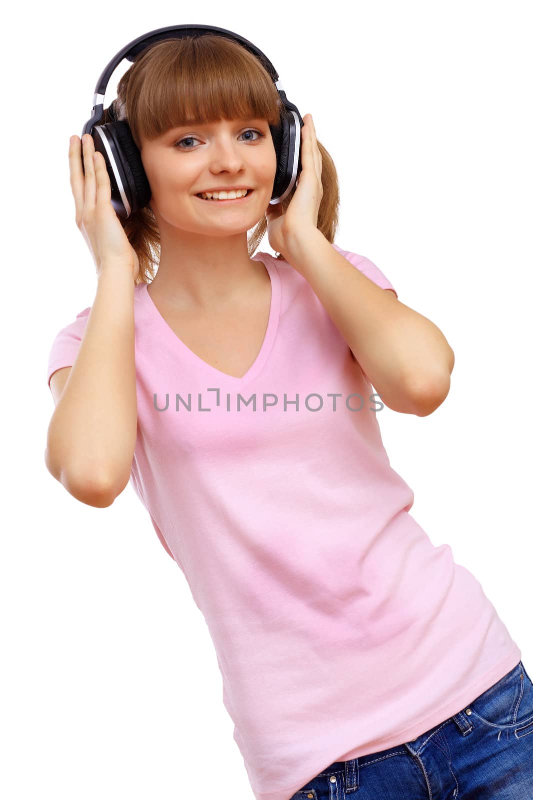 Happy smiling girl dancing and listening to music