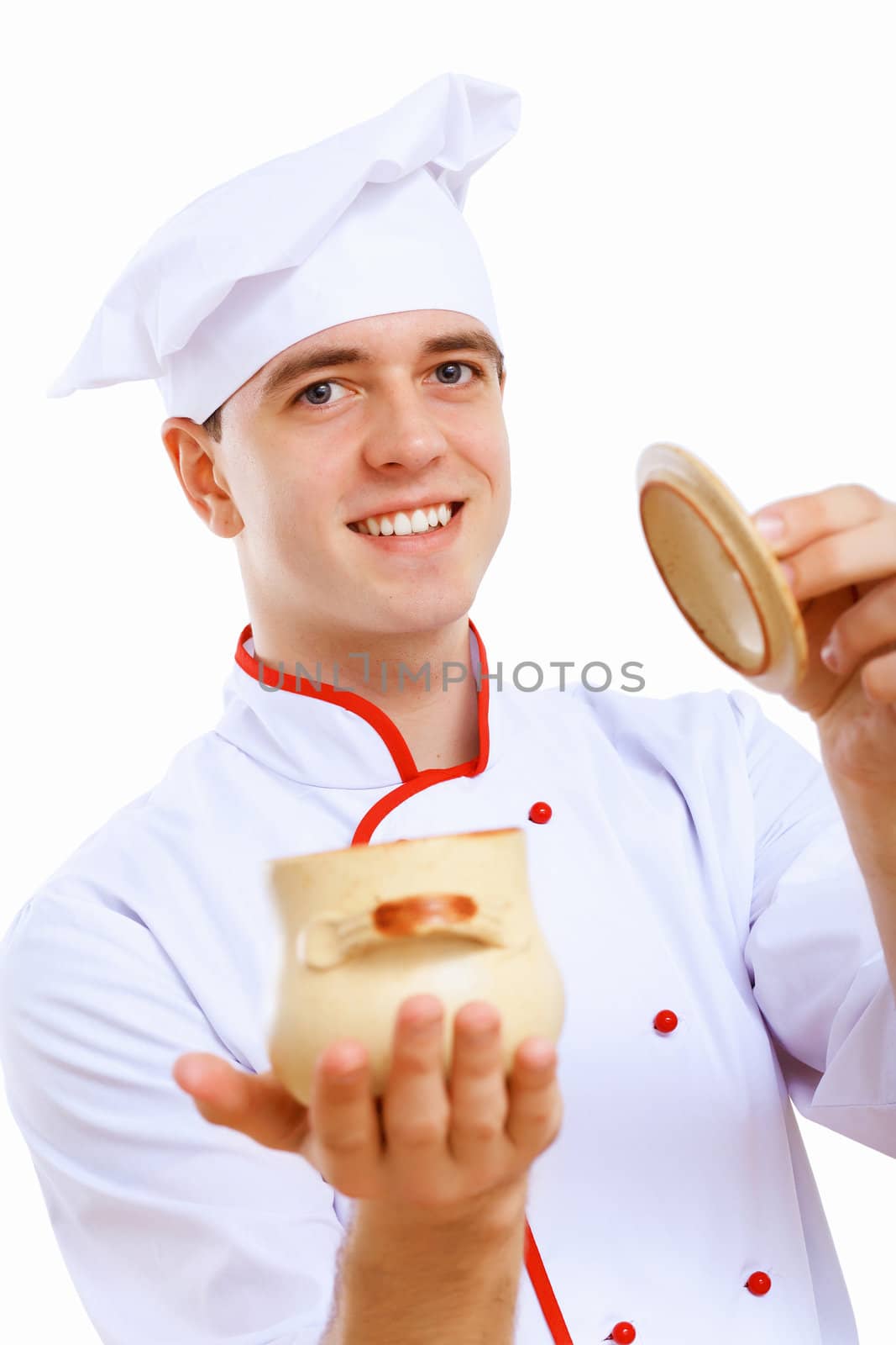 Young cook preparing food wearing a red apron