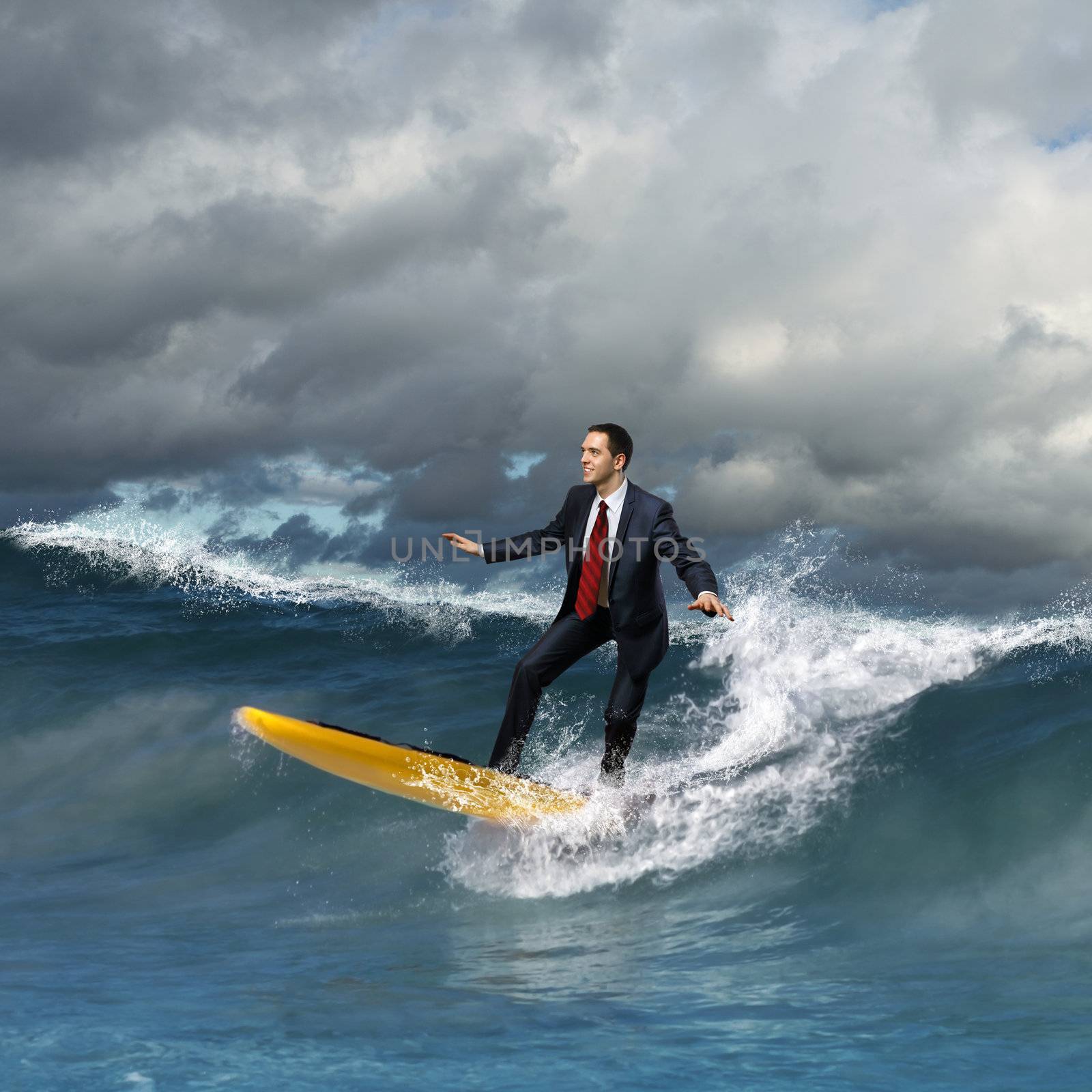 Young business person surfing on the waves by sergey_nivens