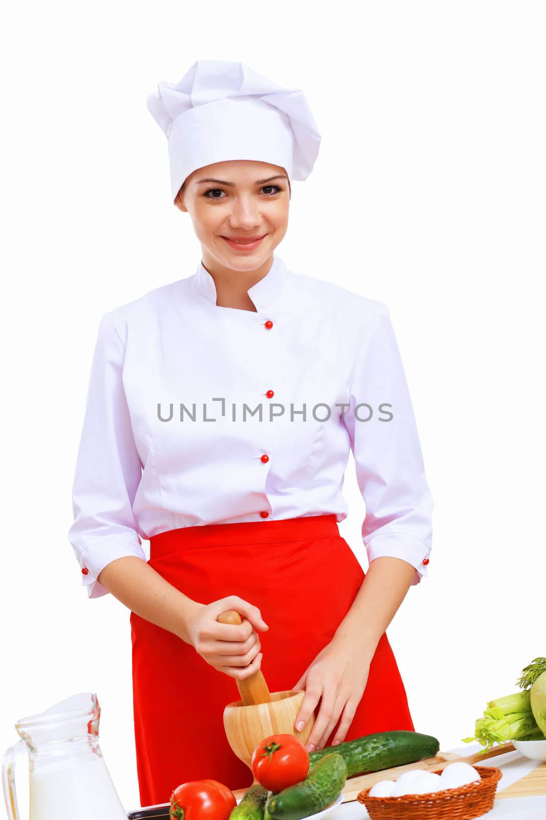 Young cook preparing food wearing a red apron