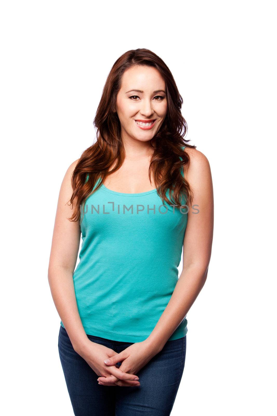Beautiful Happy smiling young woman standing with hands together, wearing casual green tank top, isolated.