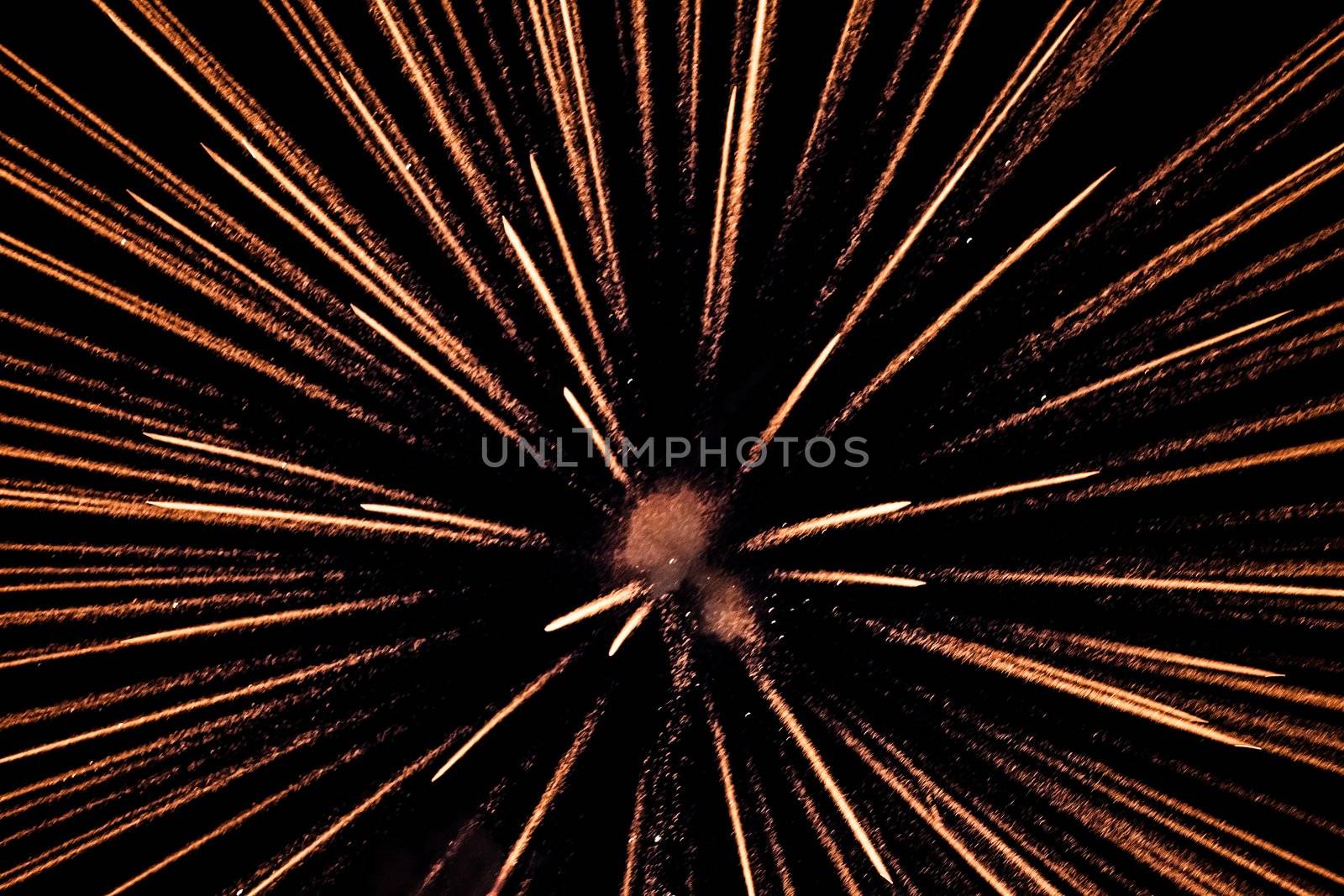 Exploding pyrotechnic firework sparks on night sky by ia_64