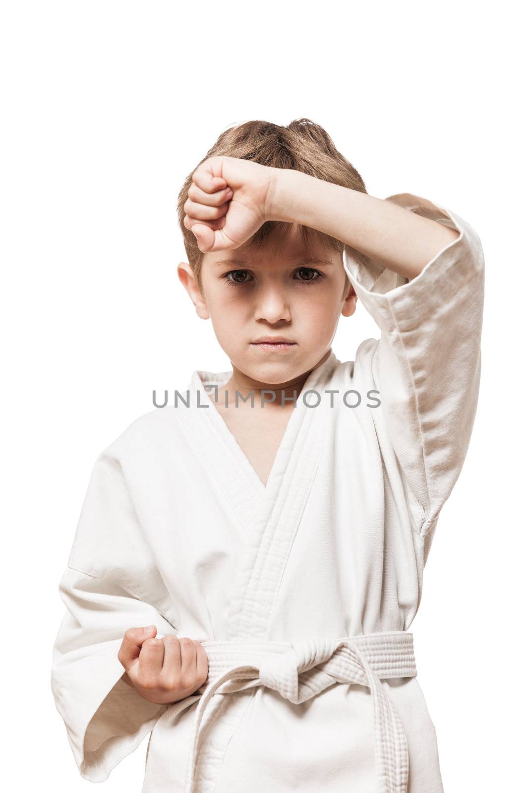 Martial art sport - child boy in white kimono training karate punch