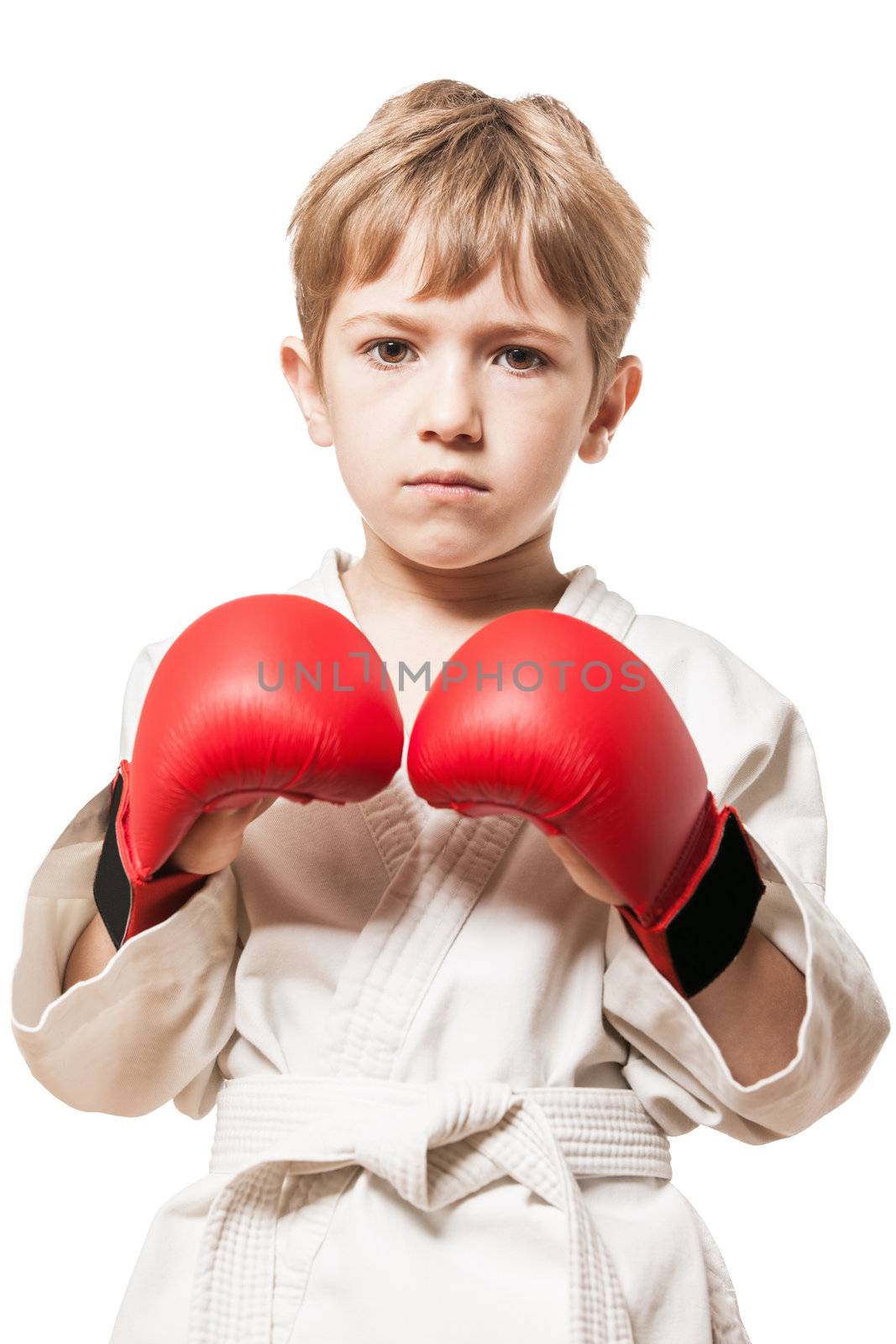 Martial art sport - child boy in white kimono training karate punch