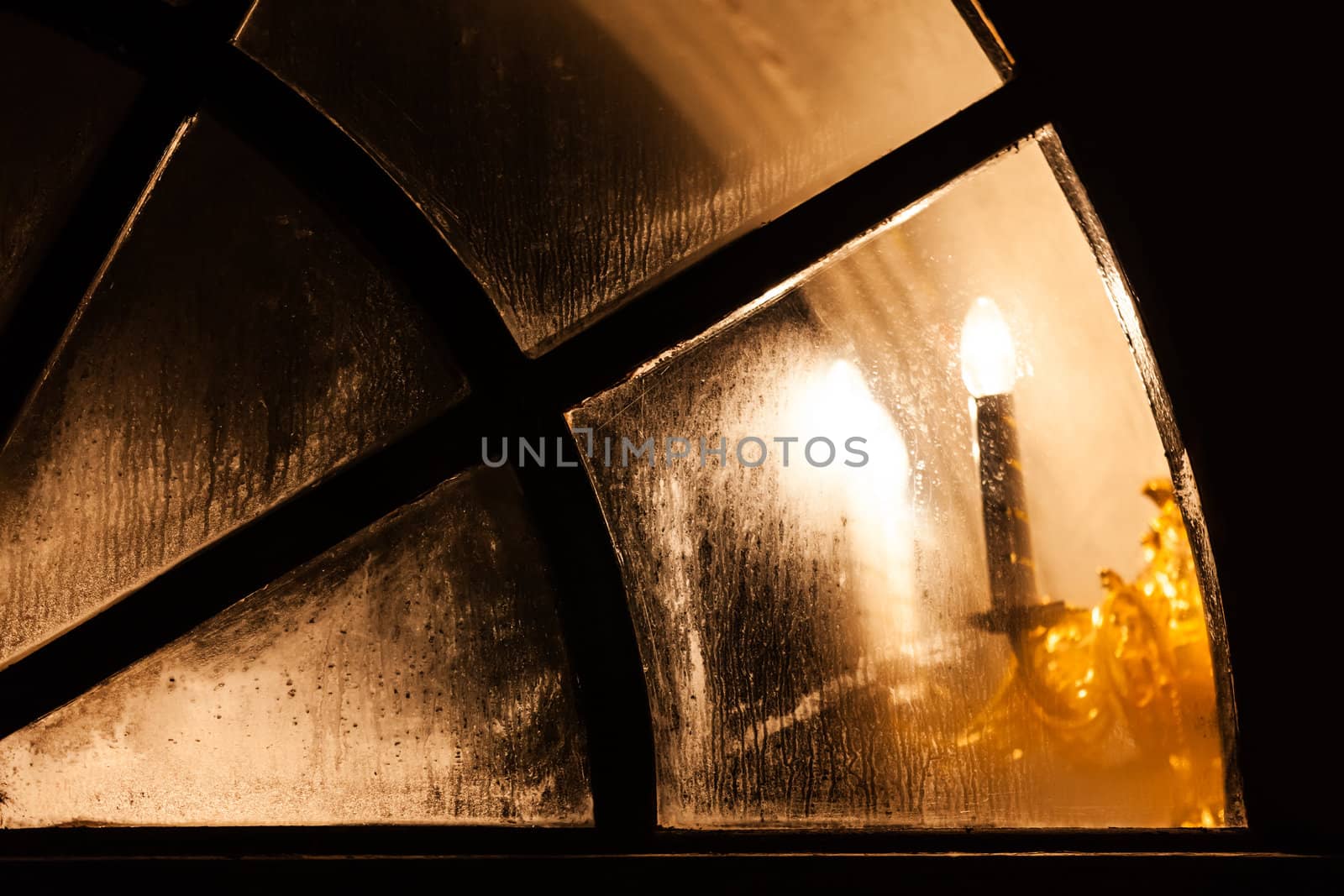 Lamp light in church window by ia_64