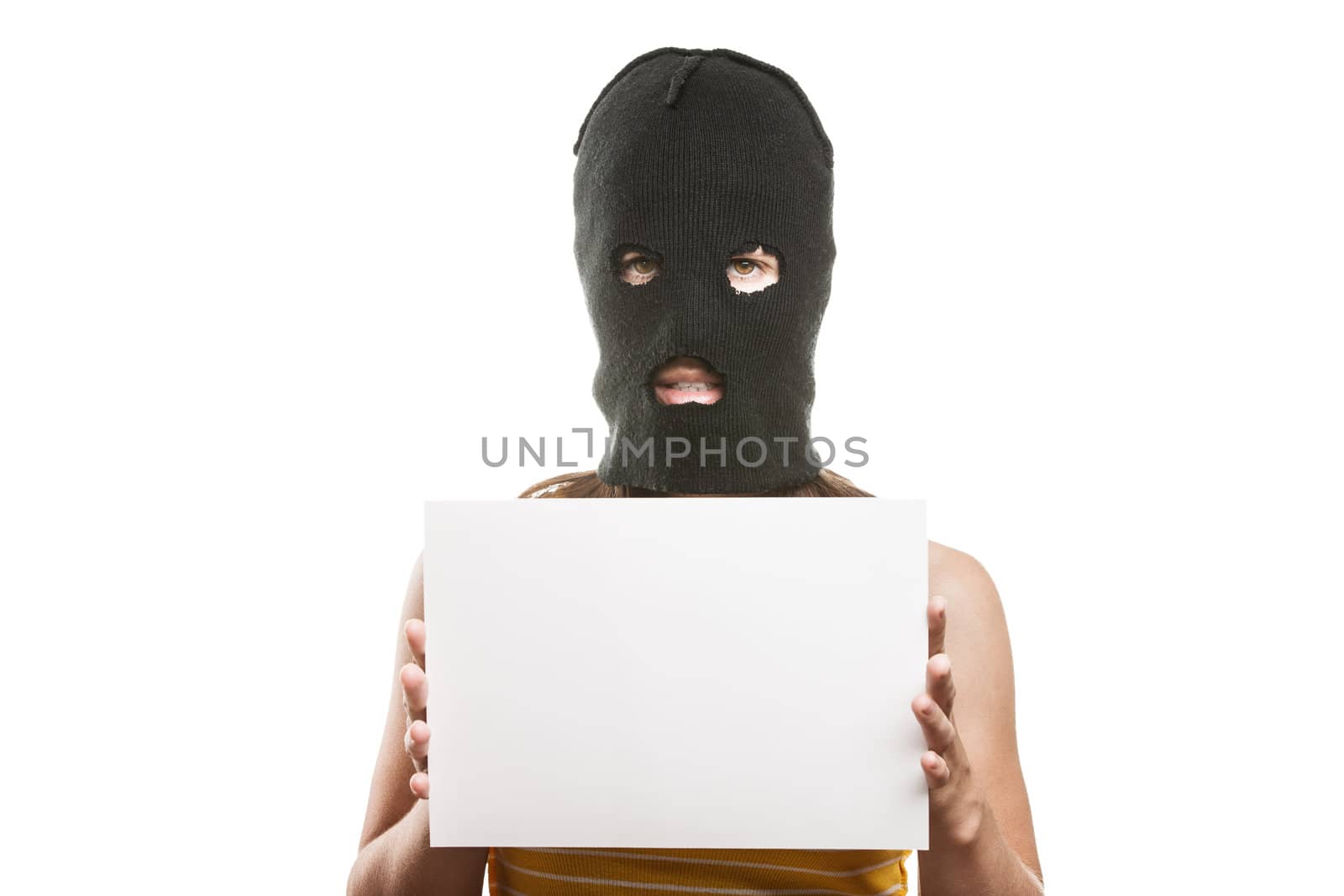 Woman in balaclava holding blank card by ia_64