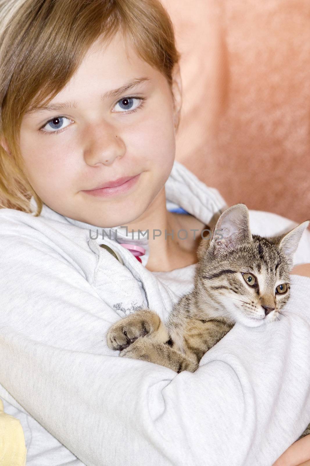 Portrait of child with kitten by miradrozdowski