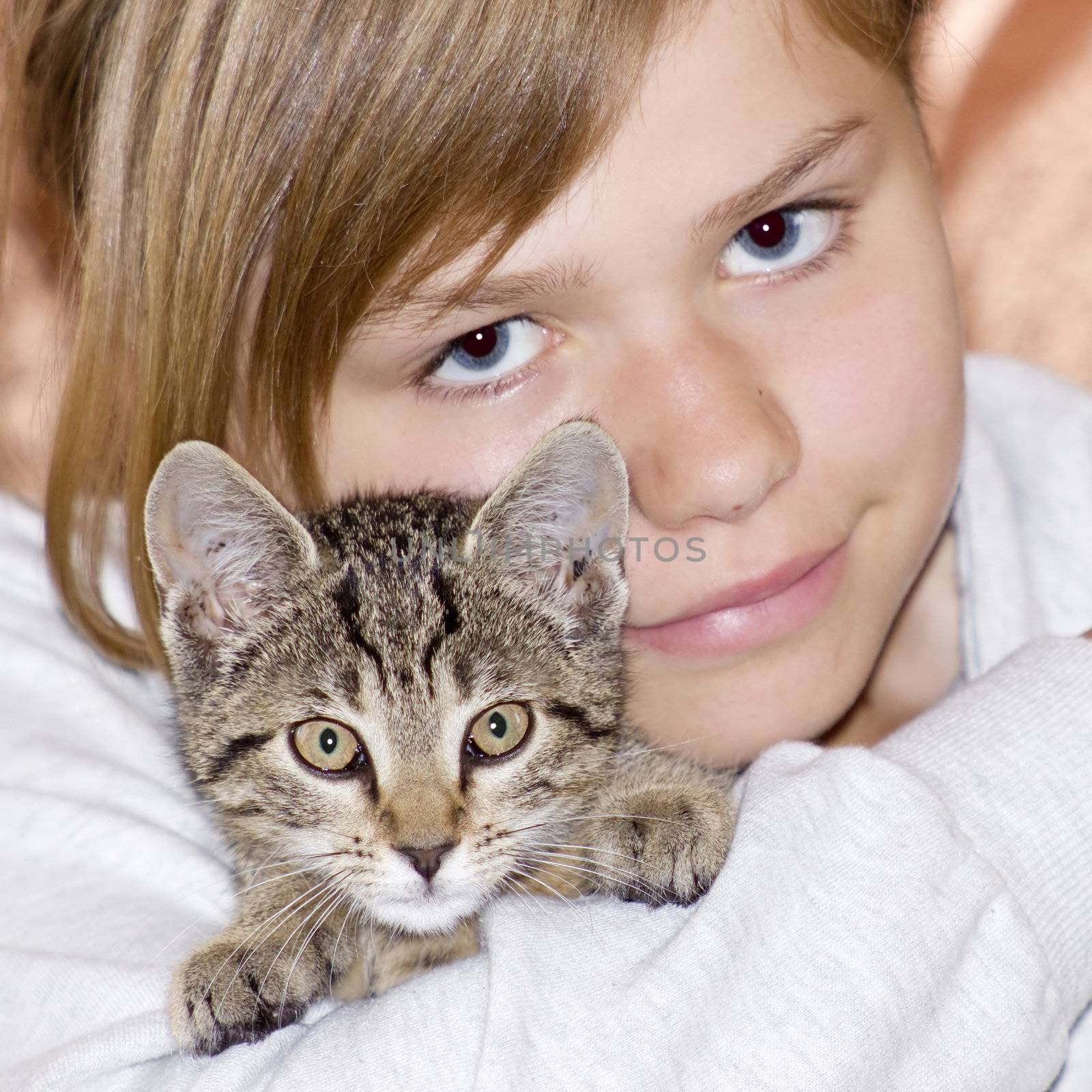 Portrait of child with kitten  by miradrozdowski