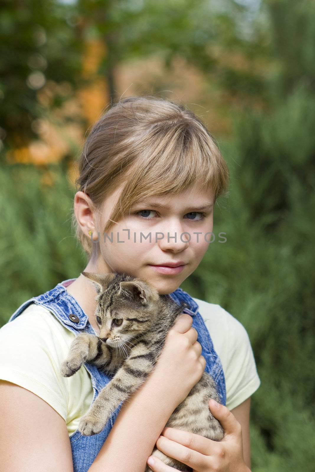 Portrait of child with kitten by miradrozdowski