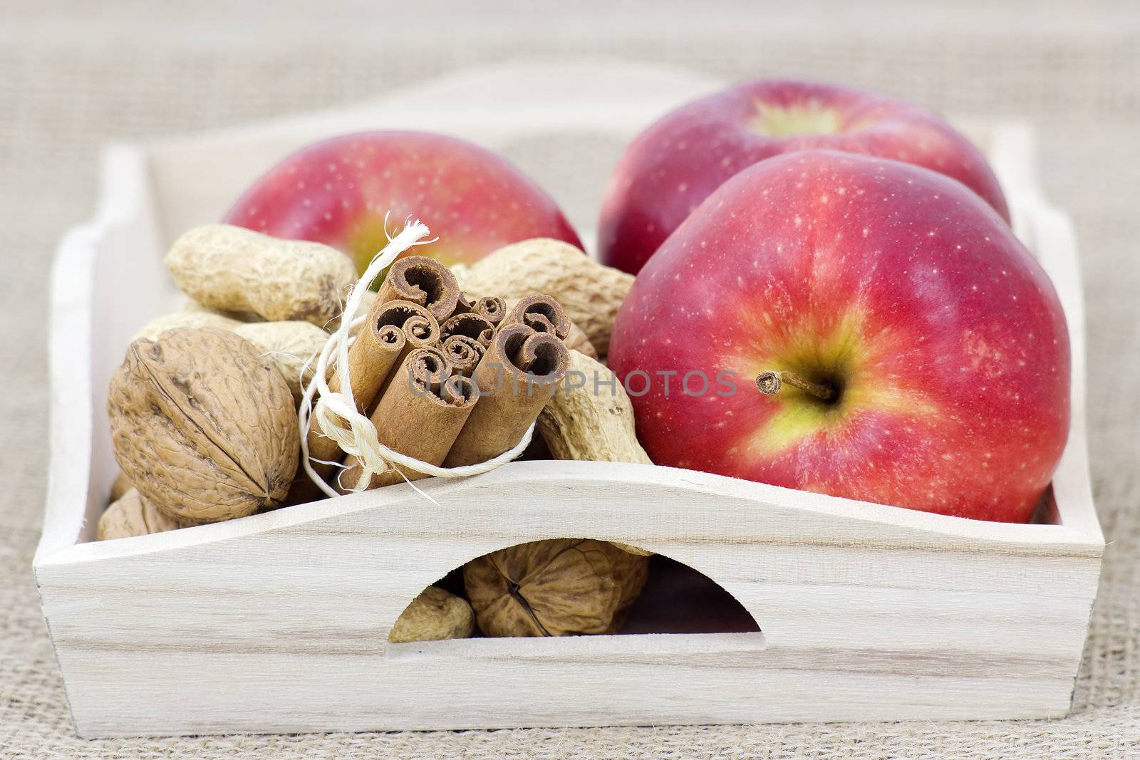 cinnamon sticks, apples and nuts