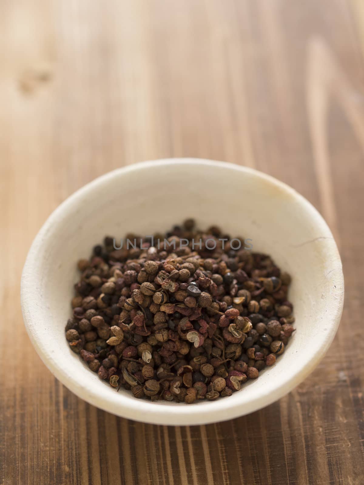 close up of a bowl of szechuan pepper