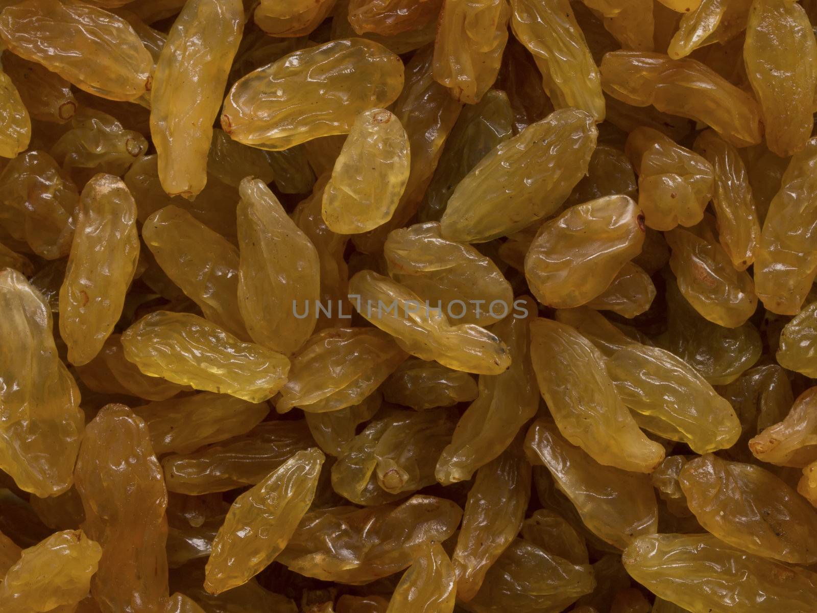 close up of golden raisins food background