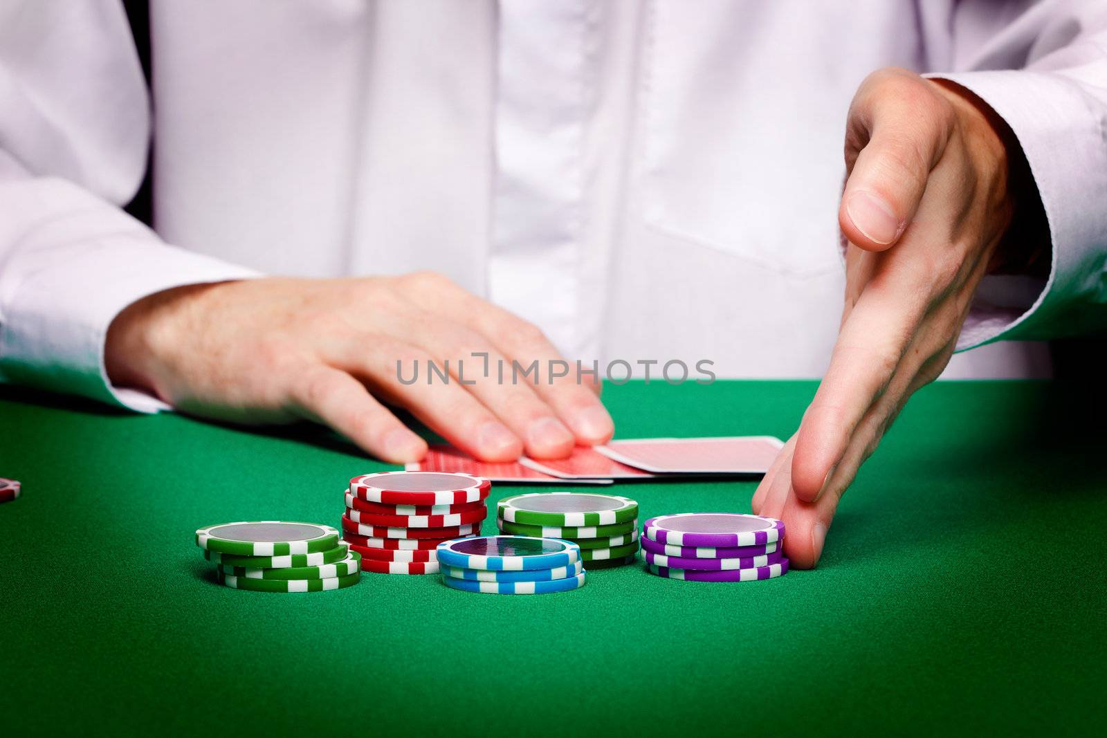 men's hands, playing cards and chips. Poker game