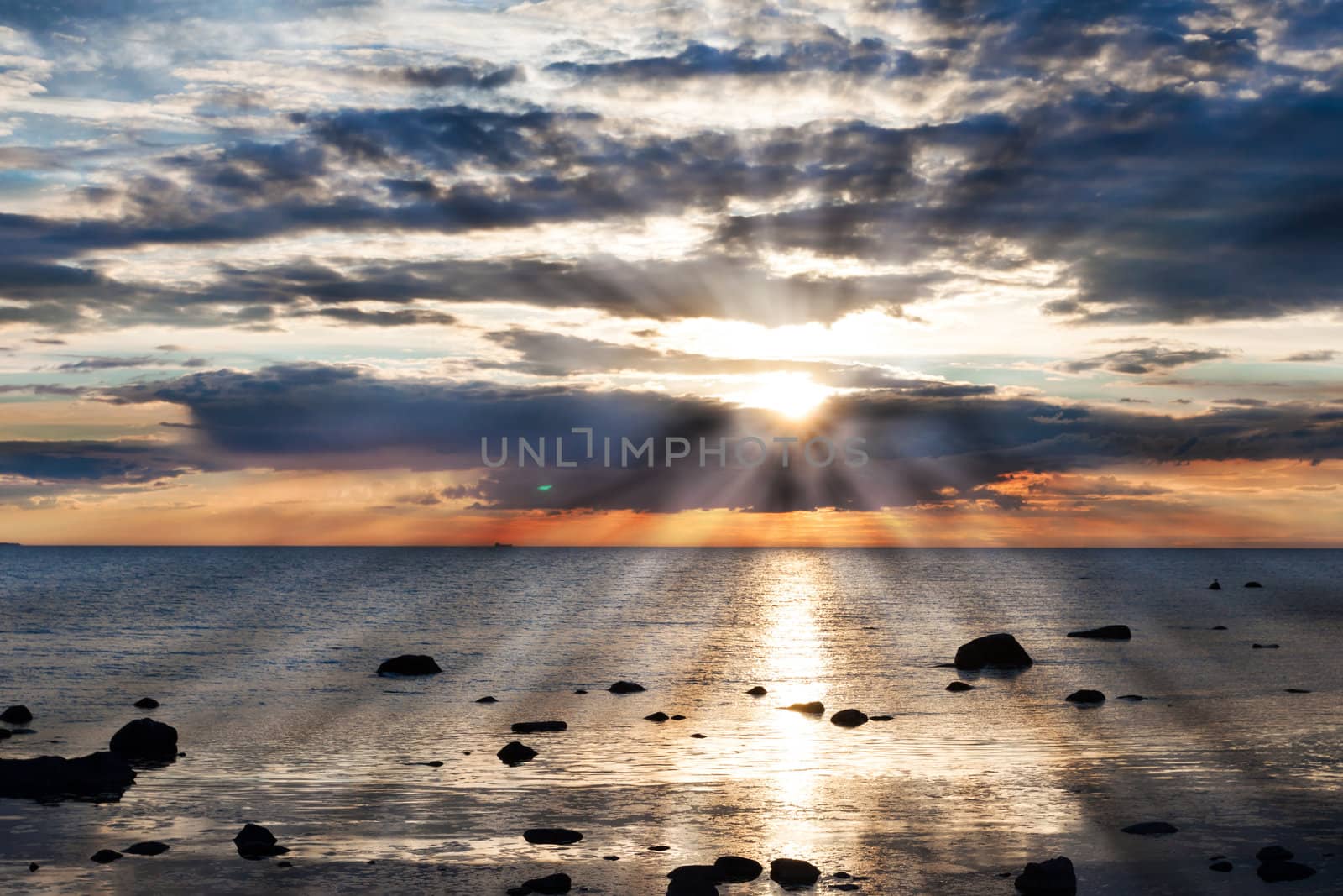 Sea and rock at the sunset. Nature composition.