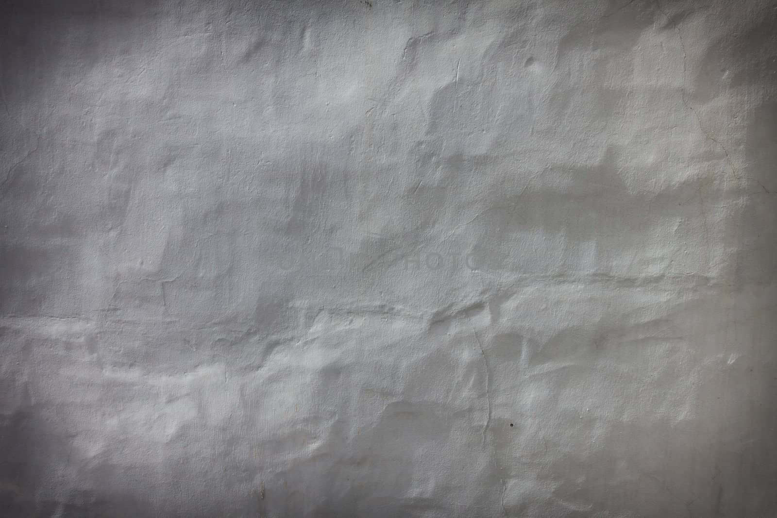 Simple plaster wall background texture, dark edged