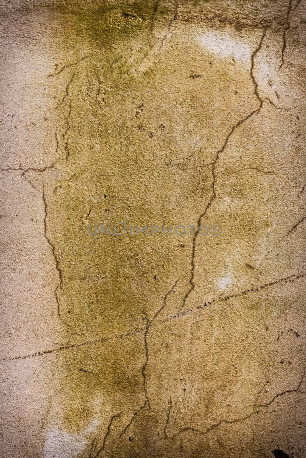 Grunge plaster stone wall background. Dark edged