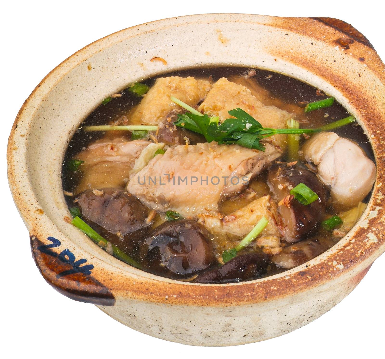 Chicken and herb soup in pot, Chinese food style.