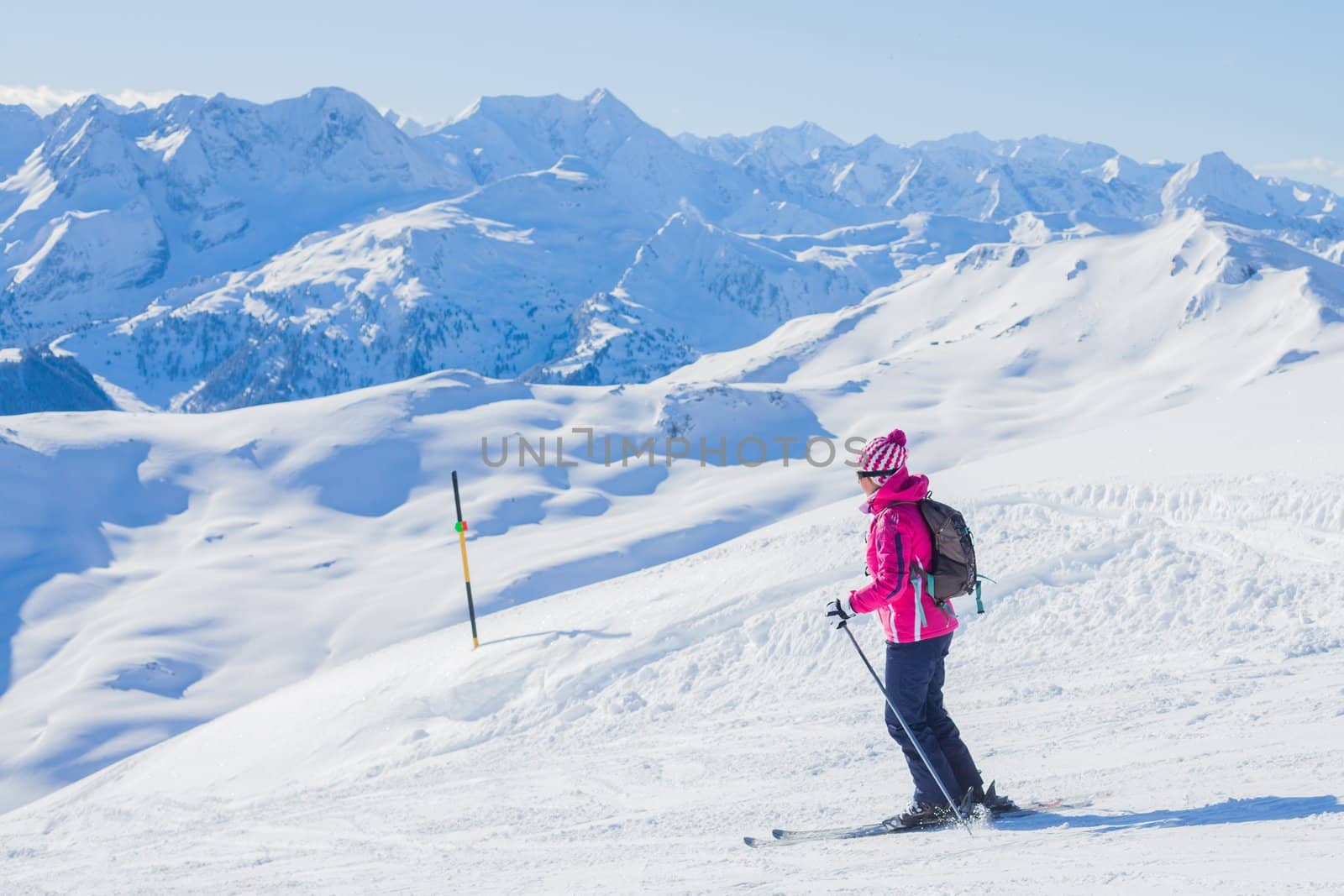 Young woman in ski outfit in the Zillertal Arena, Austria