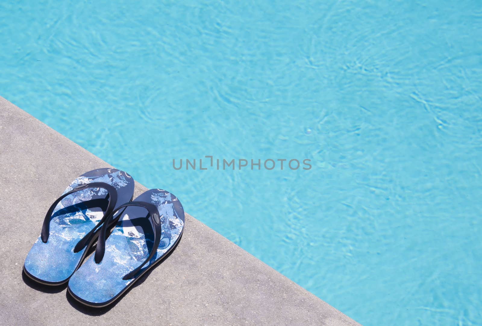 Men's flip flops by the swimming pool