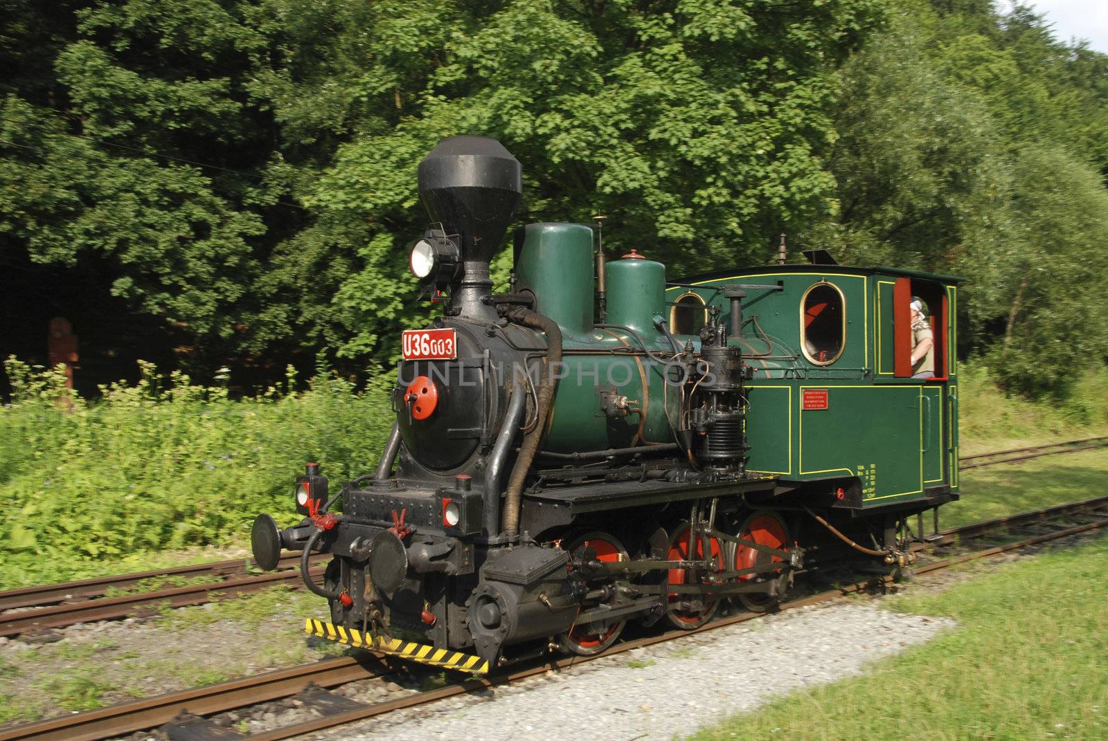 Ancient steam locomotive on a vintage railroad