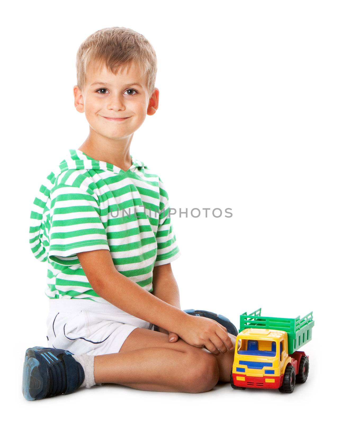 Boy holding car isolated on white background