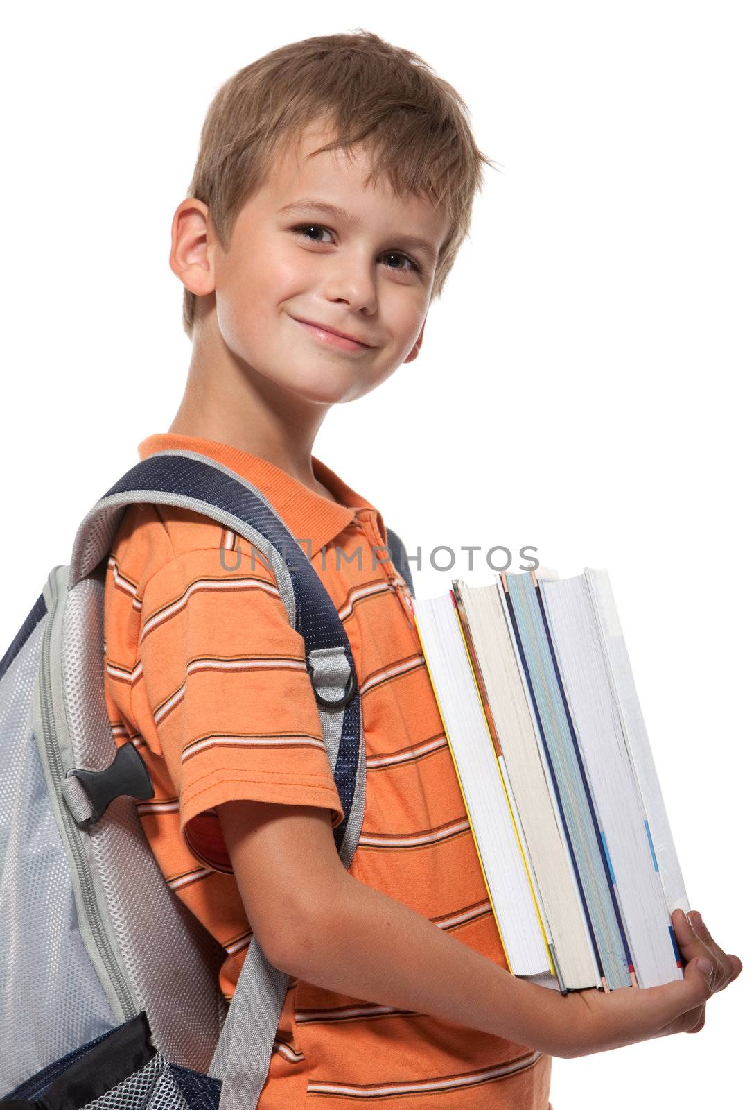Boy holding books isolated on a white background