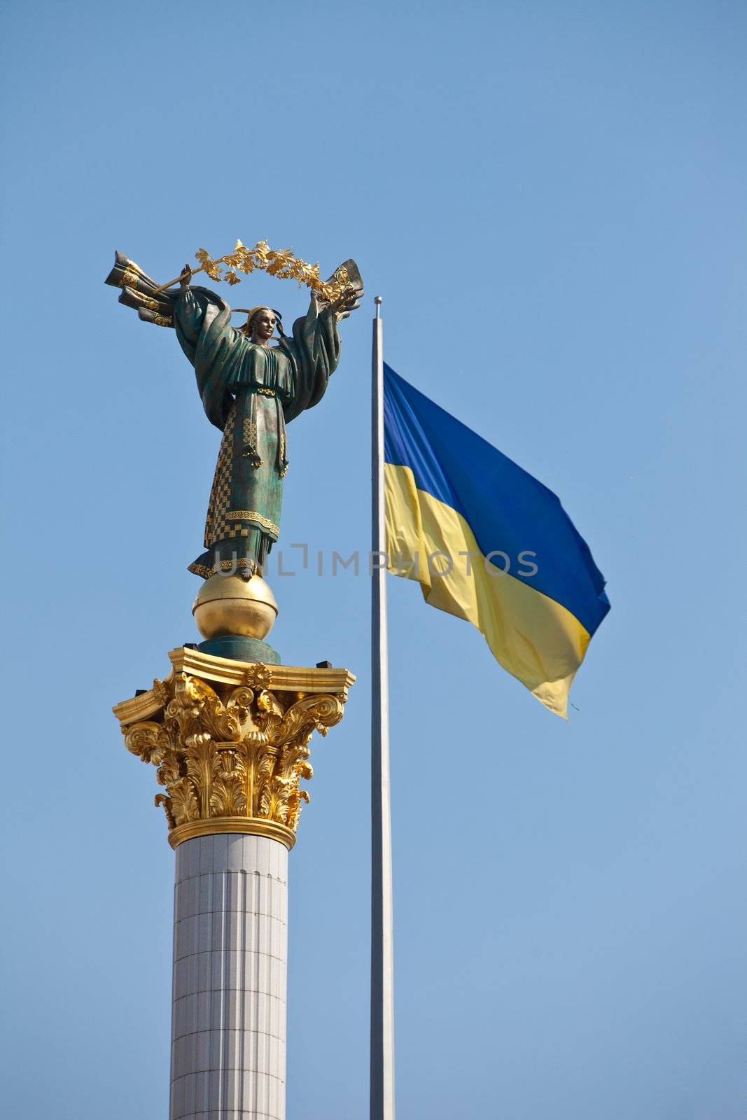 The Independence monument and ukrainian flag in Kiev, Ukraine, E by bloodua