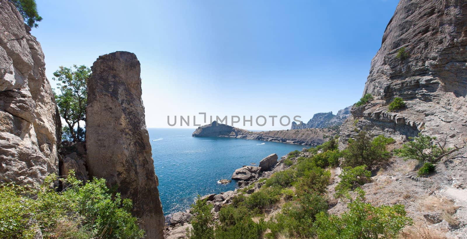 Summer view seacoast. Warm sea and beautiful nature. Sudak beach. Black Sea, Ukraine