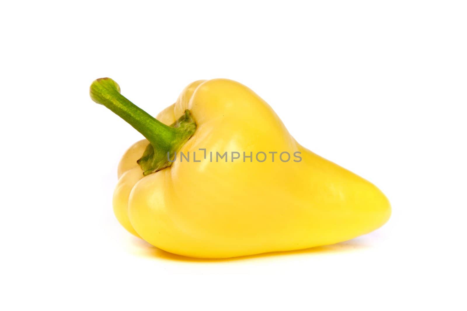 A yellow bell pepper isolated on plain white background.