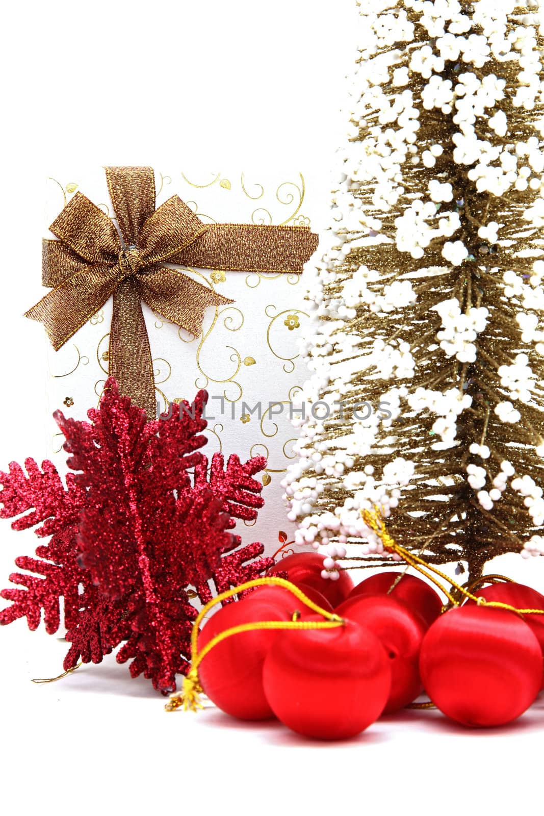 white holiday box with christmas tree and ornament