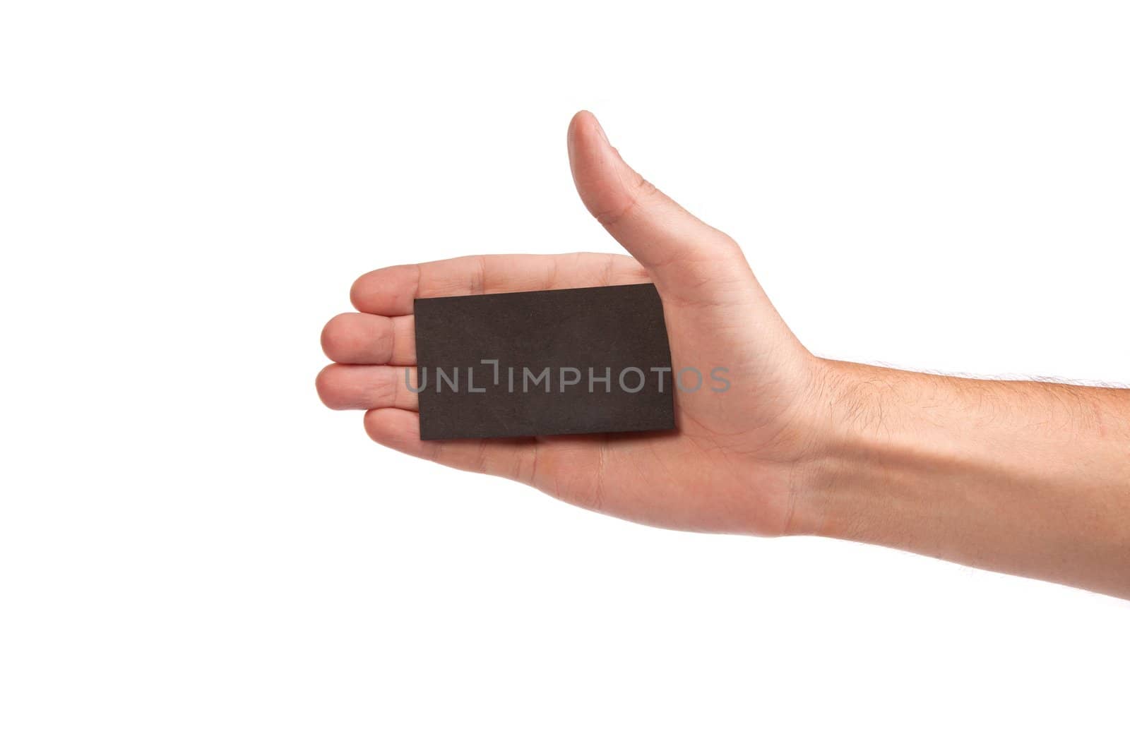 Businessman's hand holding blank paper business card, closeup isolated on white background