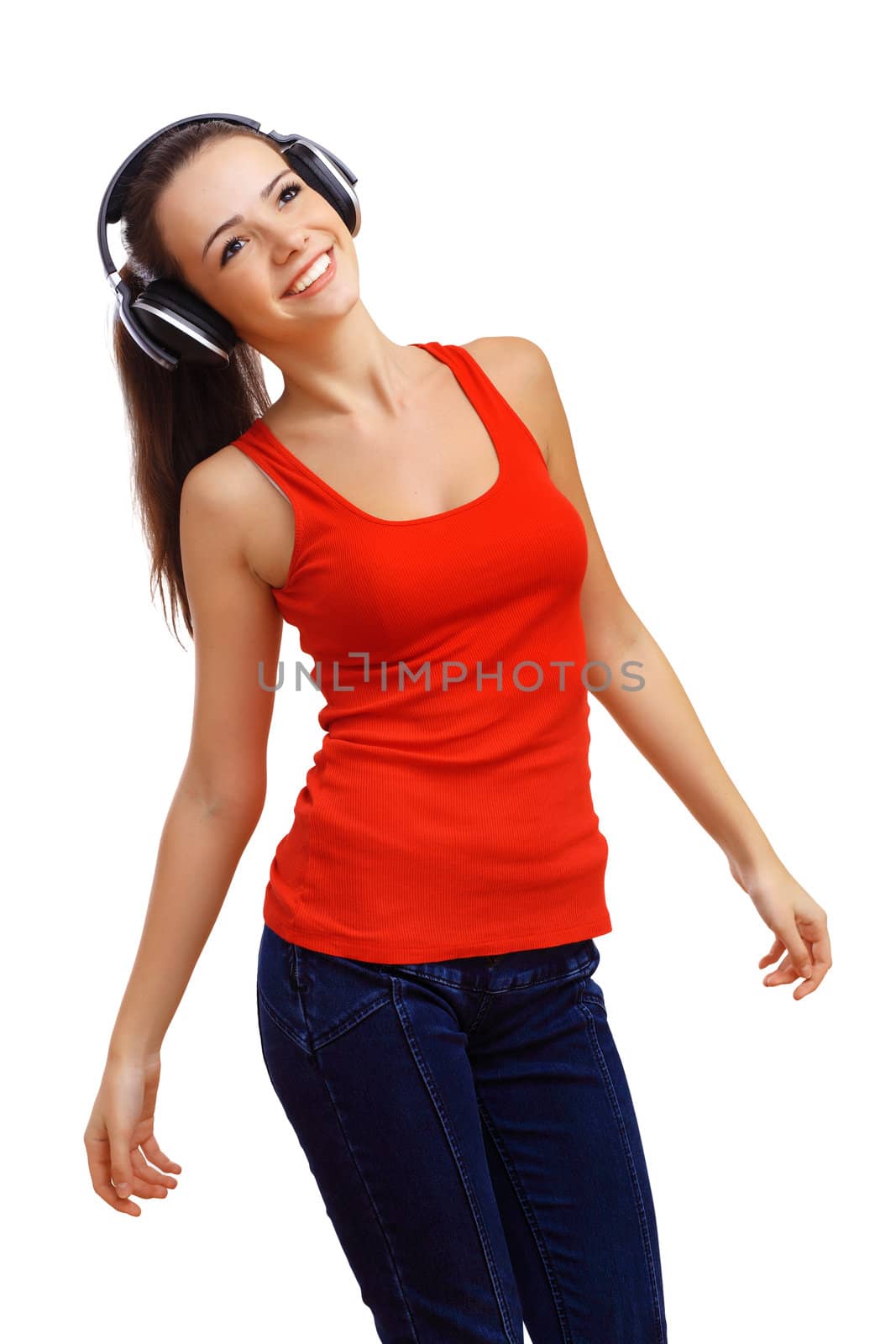 Happy smiling girl dancing and listening to music