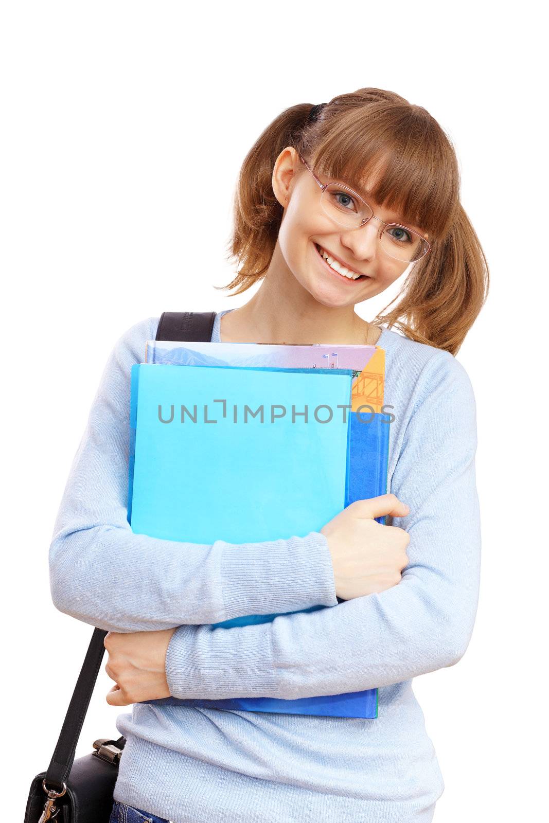 Happy smiling student standing and holding books