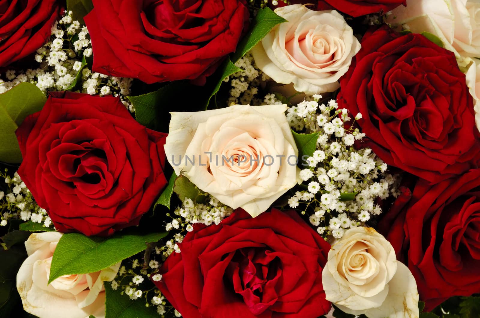 Flower bouquet of red and pink roses. 