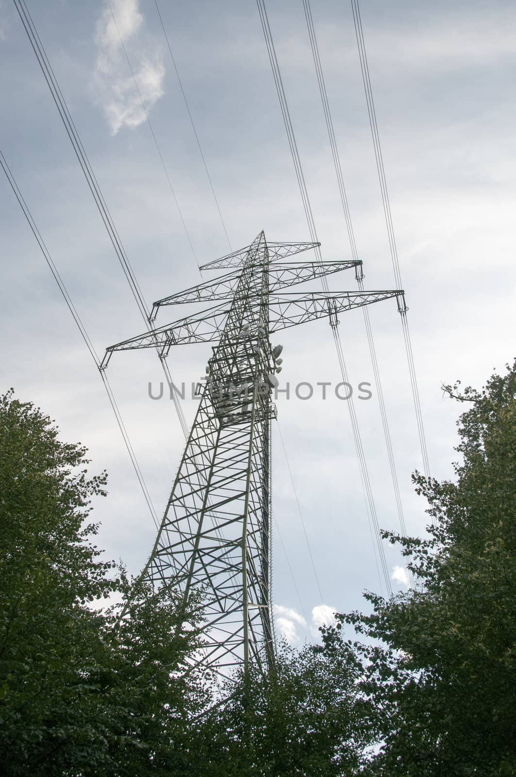 high voltage power electricity pylons under sky