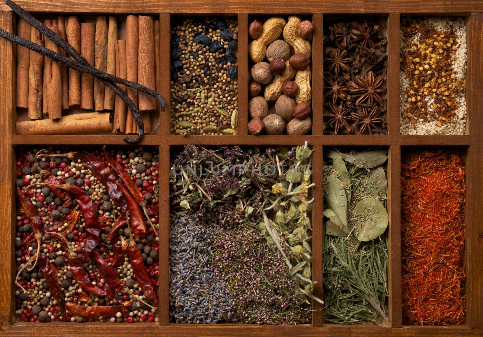 Nine Sections in Wooden Box with Mixed Spices, Herbs and Dried Leafs close up
