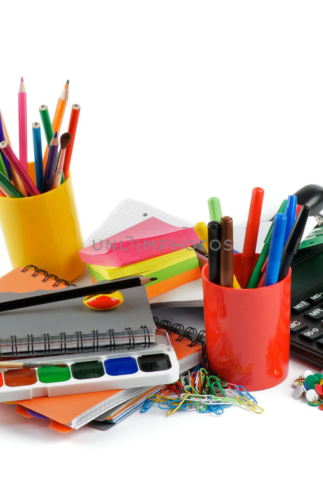 School supplies. Ballpoint Pens, Colored Pencils, Paintbrush, Felt Tip Pens, Pencil Sharpener, Watercolor Paints, Paper Clips, Calculator, Stapler, Ruler, Protractor, Notebooks and Sticky Notes
