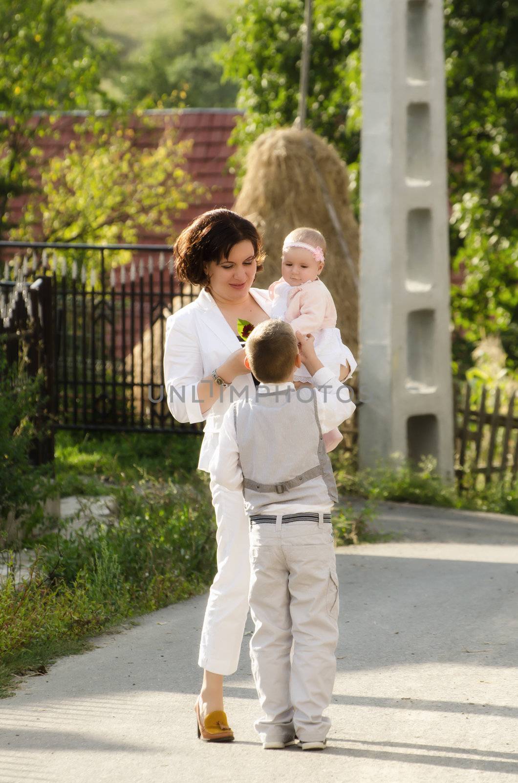 Young mother with two childrens outdoor