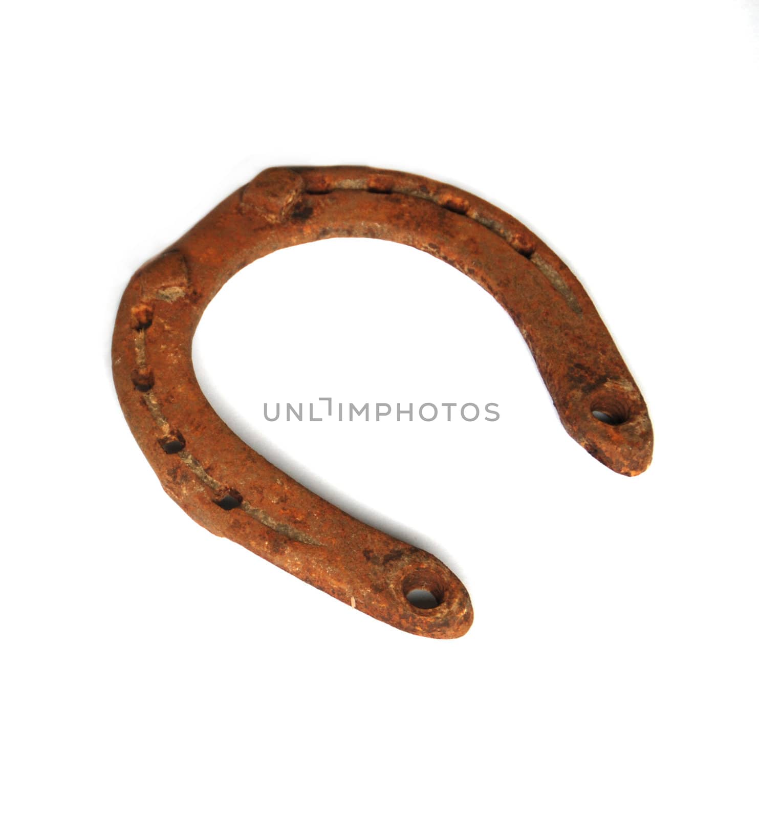 Old rusty horseshoe isolated on the white background